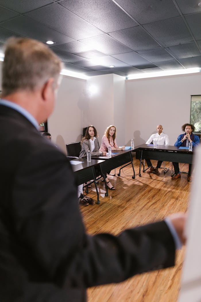 Diverse team in a business meeting discussing strategies in a conference room.